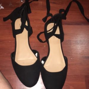 Cue black lace up flats .